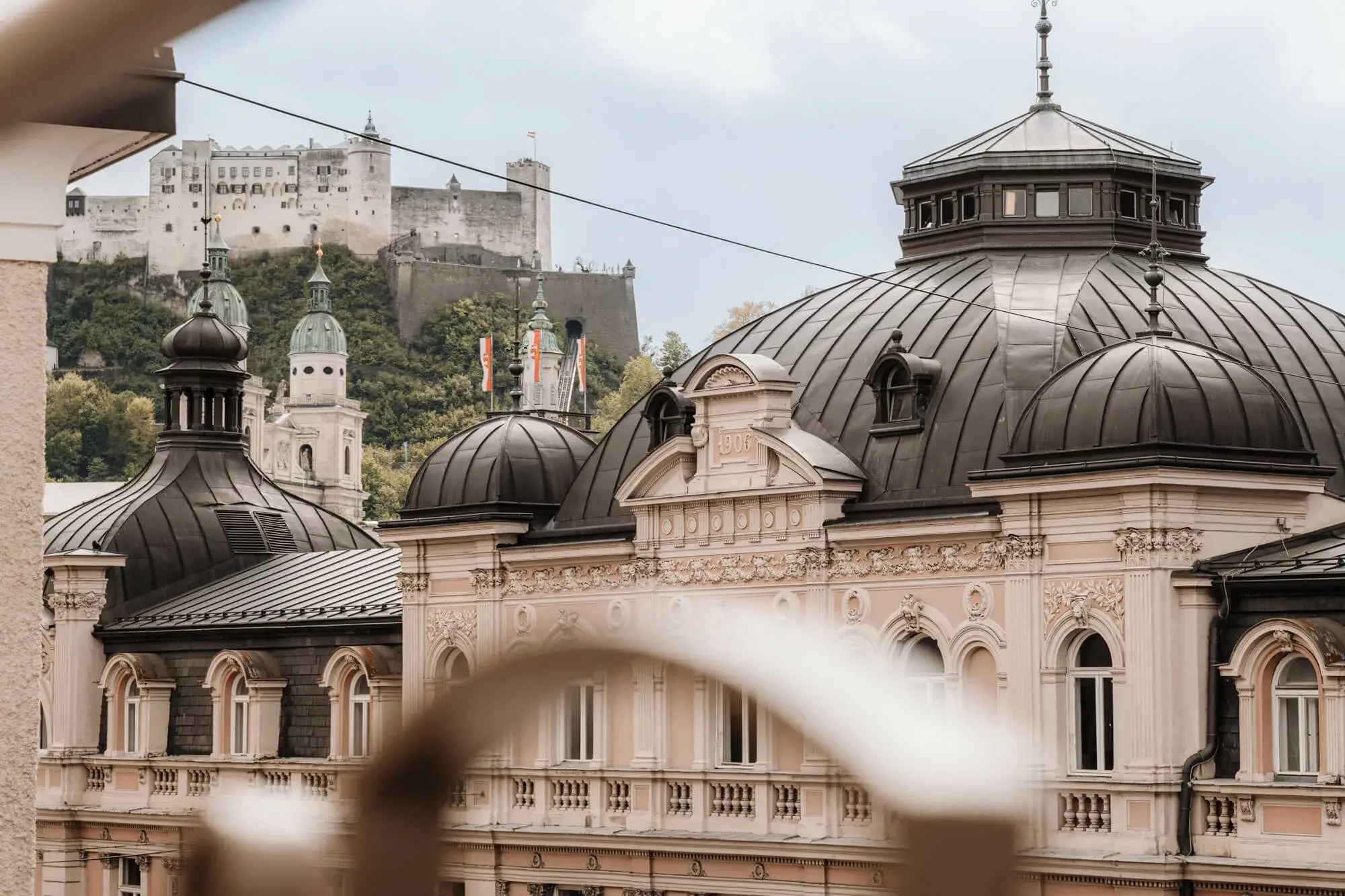 A view of the Salzburg Fortress from one of the rooms, offering a scenic and picturesque outlook of the historic landmark against the backdrop of the surrounding landscape.