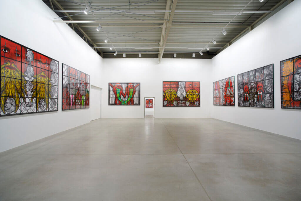Contemporary art gallery in Salzburg featuring stained glass-style artworks