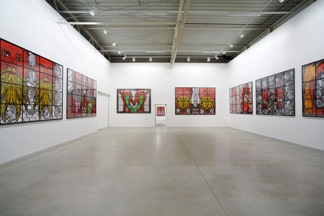 Contemporary art gallery in Salzburg featuring stained glass-style artworks