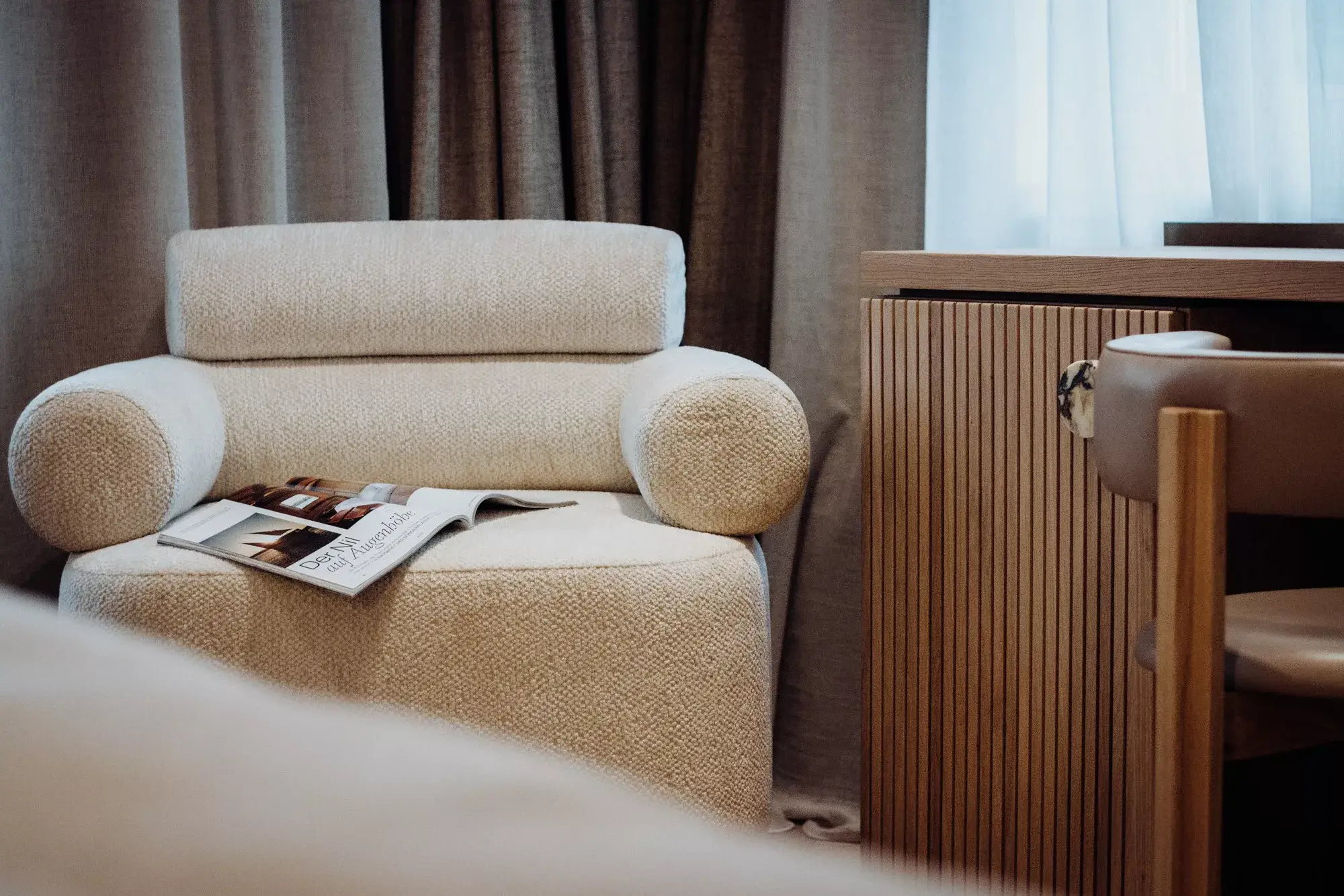 Relax in the lounge area of the garden hideout at Gentle Hide, surrounded by tranquil and lush surroundings for a peaceful retreat.