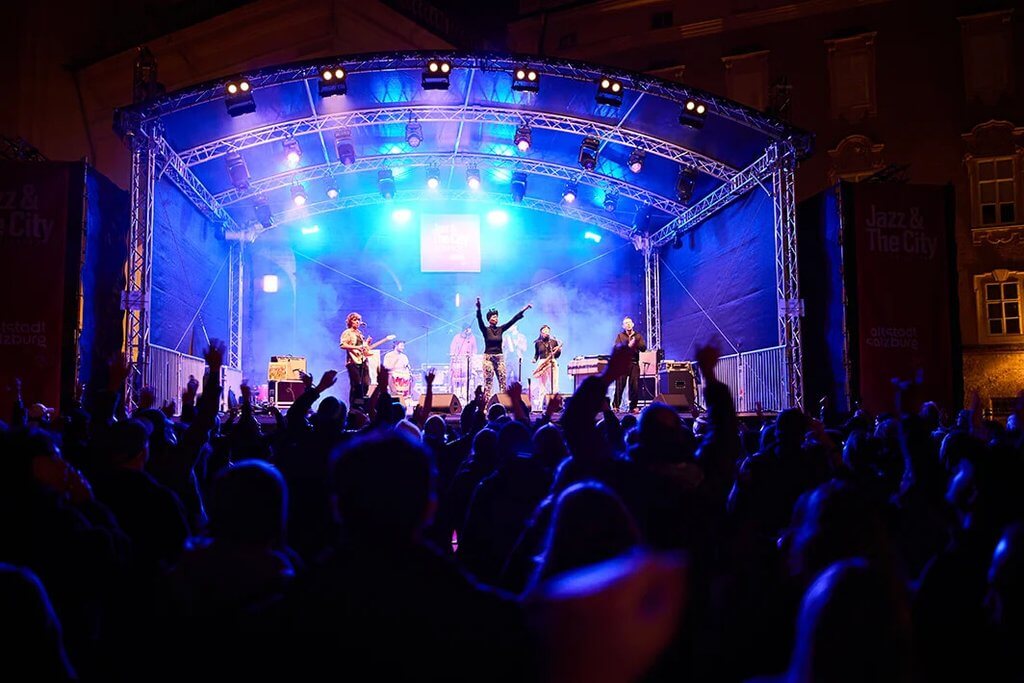 Jazz & The City Salzburg band performing live on stage to an enthusiastic crowd.